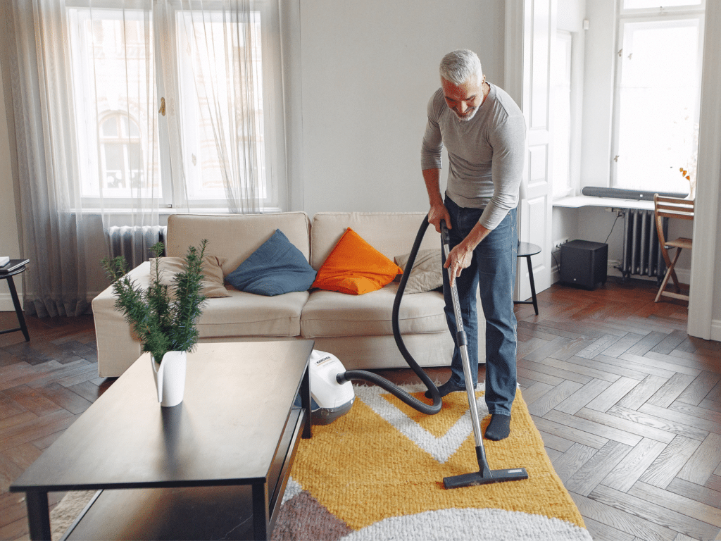man vacuuming home HendrixAir